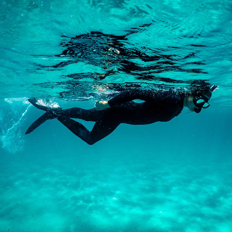 Fourth Element Women's Surface Suit 4/3mm, worn by a diver