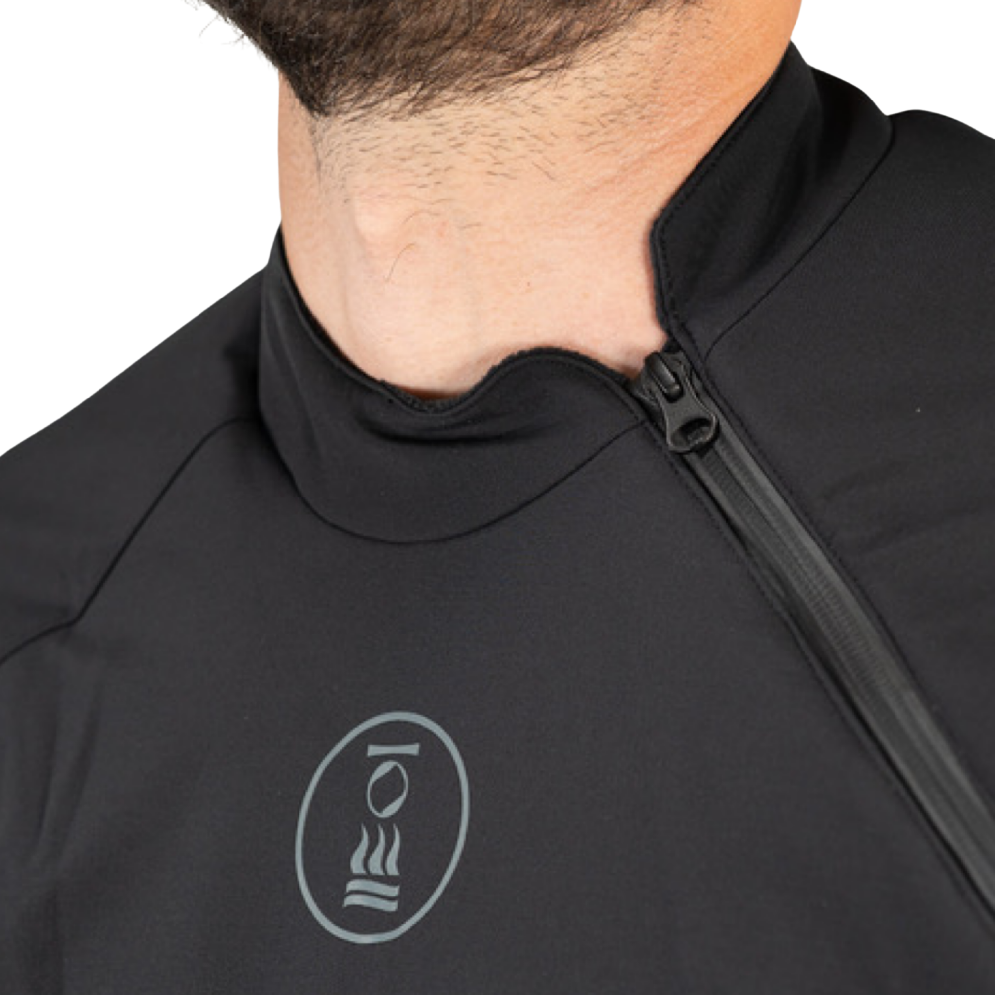 Close-up of a person wearing a black quarter-zip athletic top with a gray circular logo on the chest, against a plain white background.