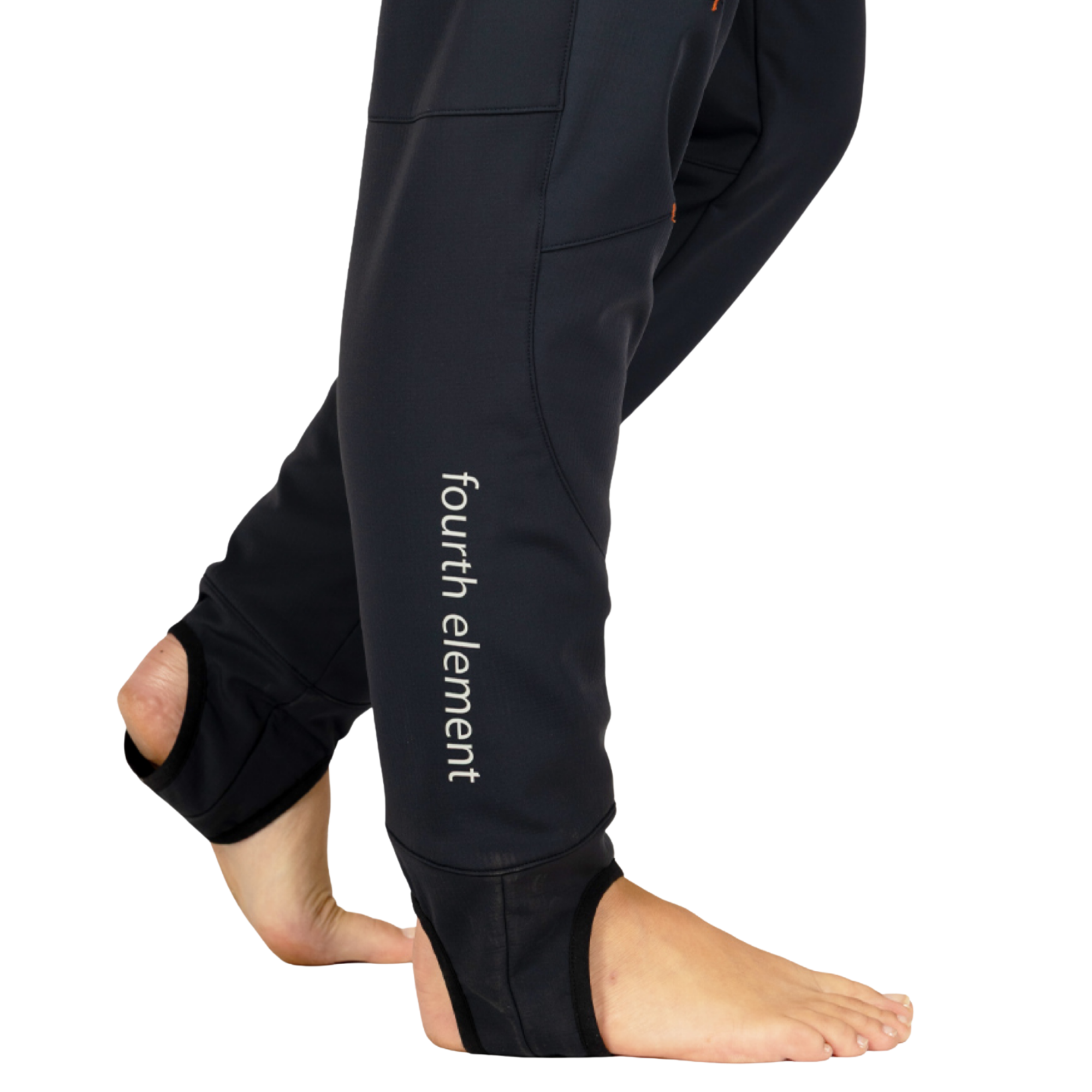 Black pants worn by a model, shown from the side with bare feet visible. The pants have a vertical white 'fourth element' logo printed on the lower leg.