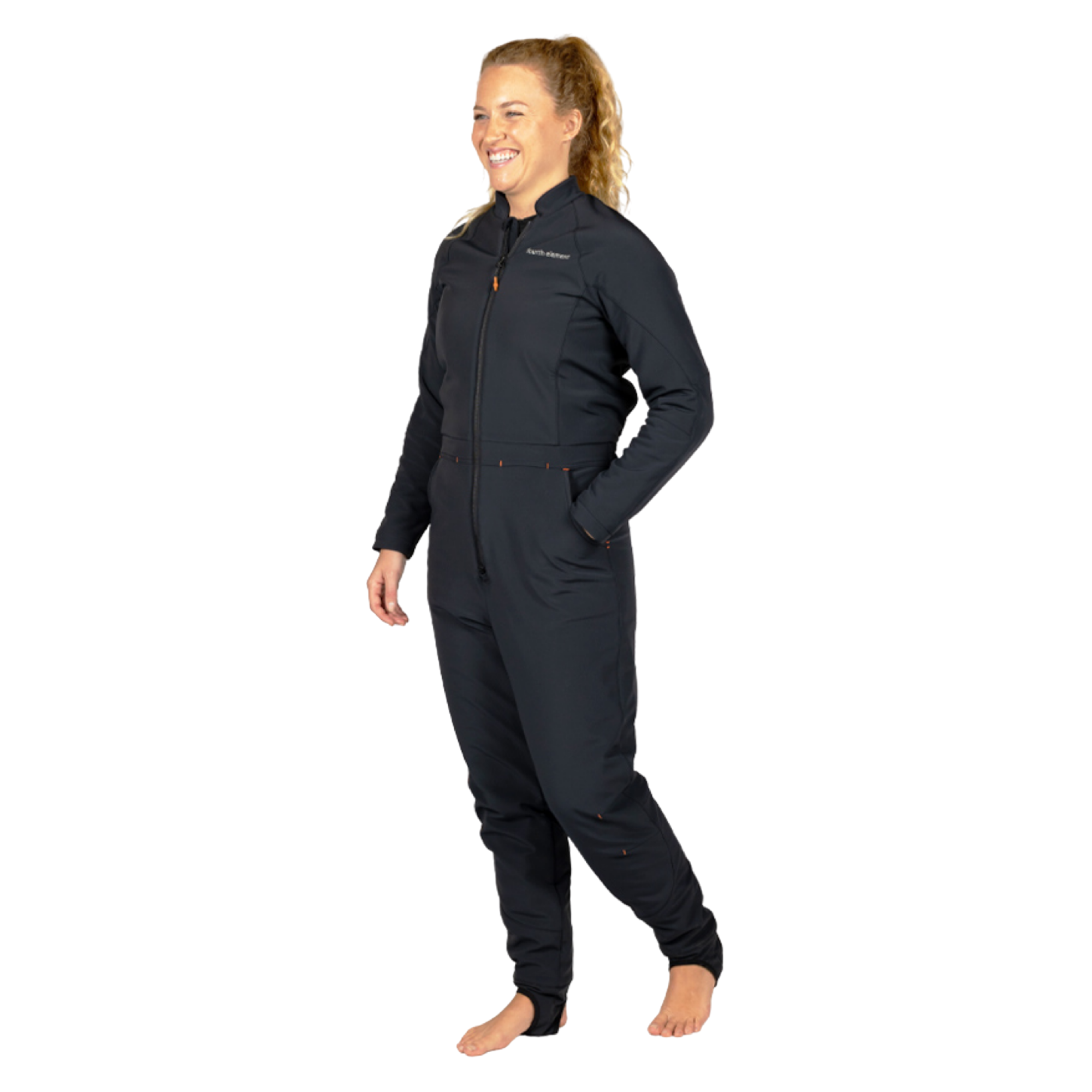 A woman modeling a dark navy full-body jumpsuit against a plain white background.