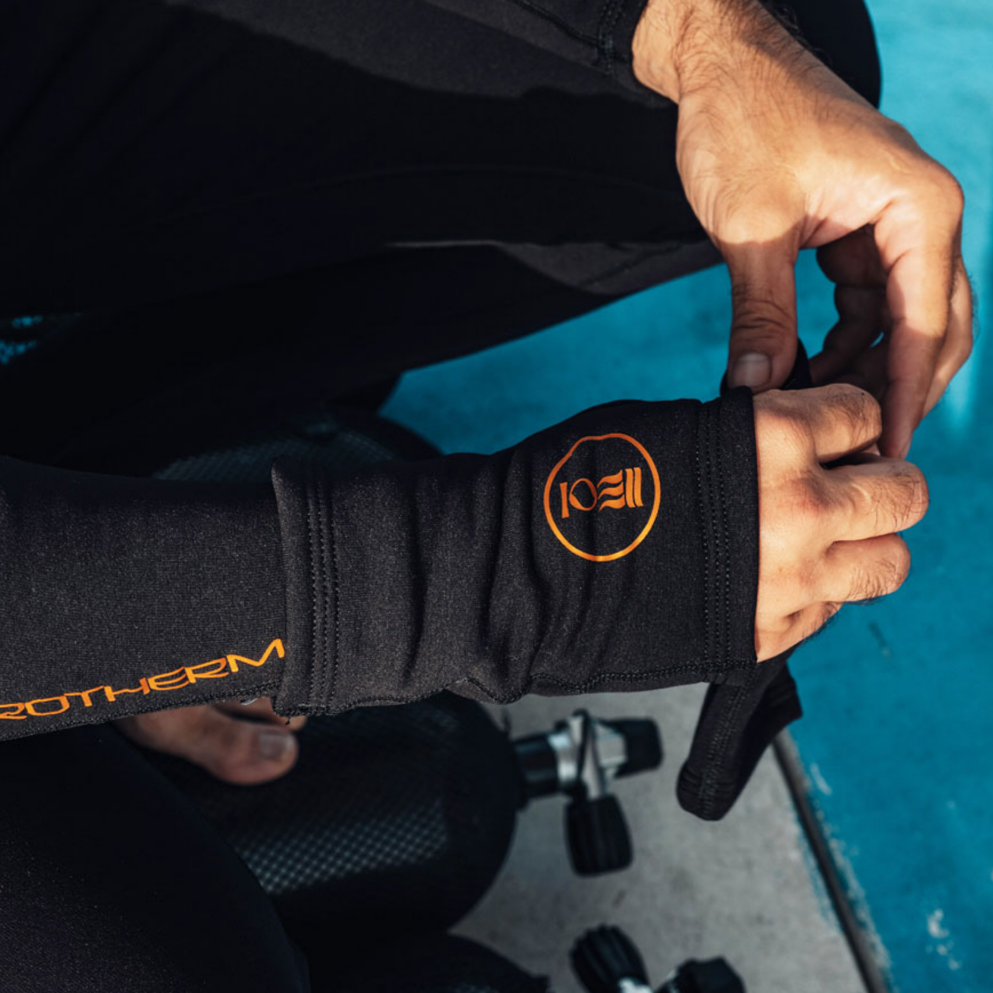 Fourth Element Xerotherm Wrist Warmer, worn by a diver
