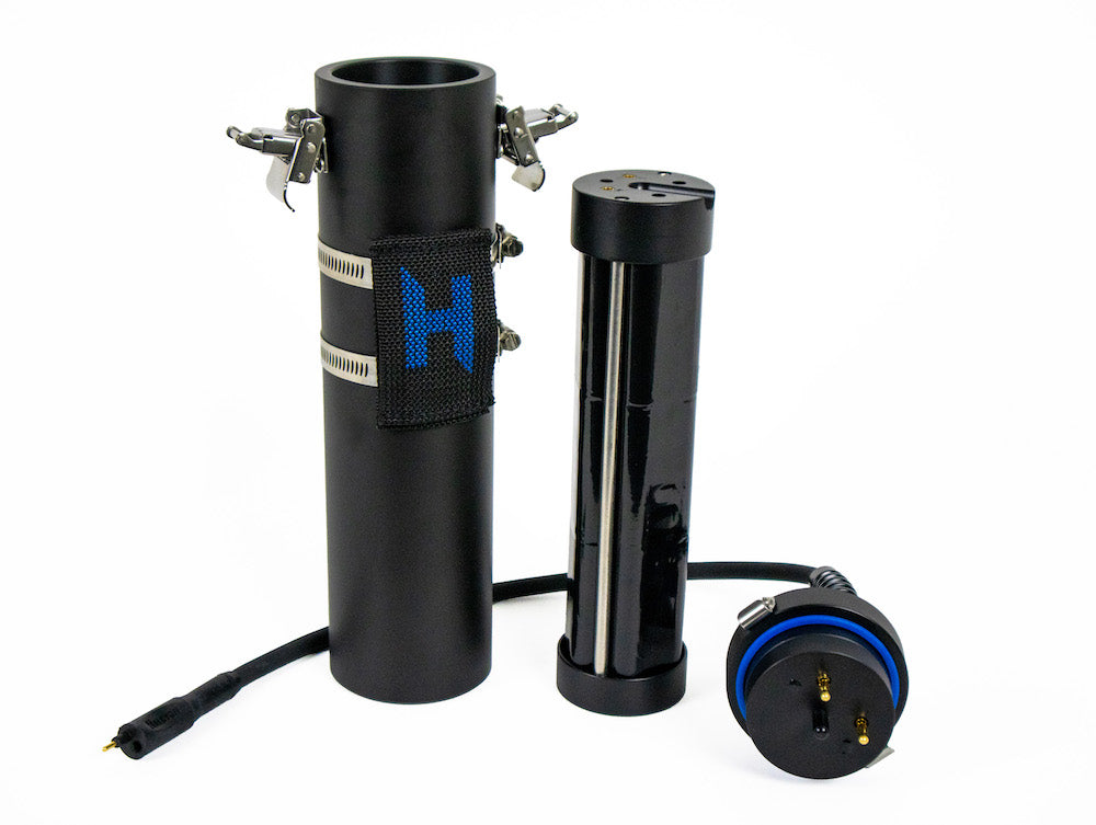 A black canister with 20-AMP Hour Lithium Battery next to it with blue Halcyon logo on white background