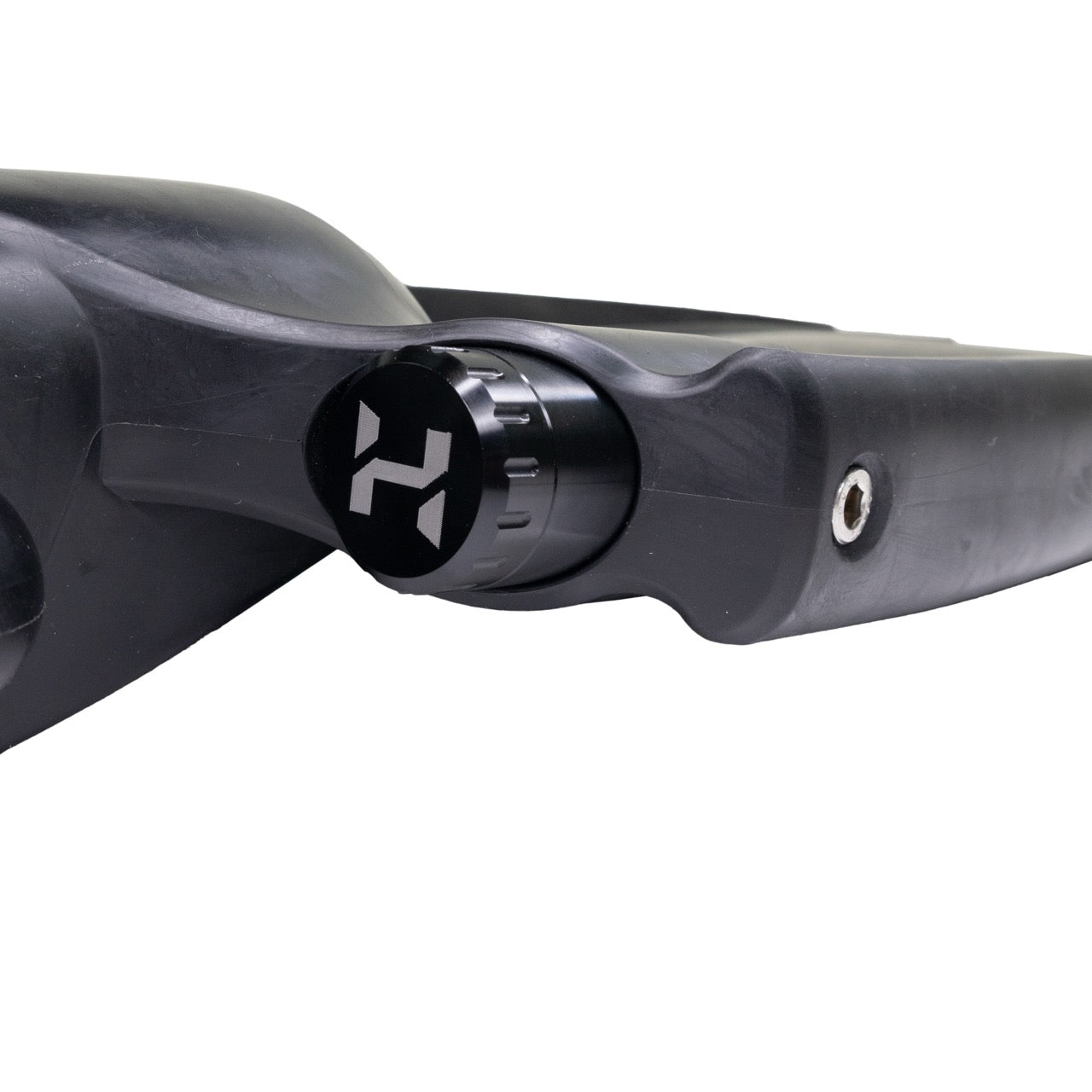 Close-up of a black Halcyon Vector Pro Fin and Weight Accessory Canister stylized 'H' logo on a white background.