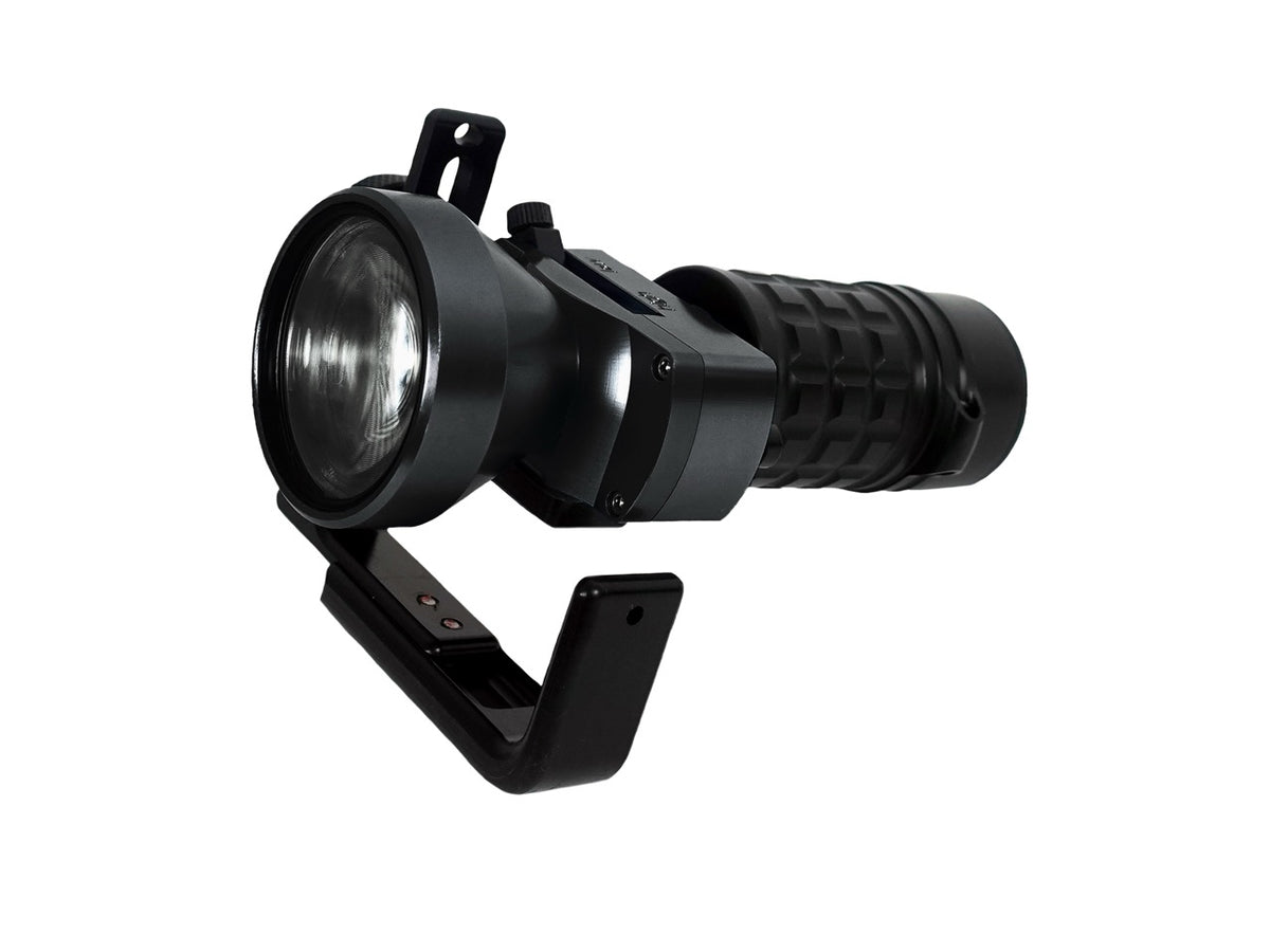 A black Halcyon Dive Light handheld on white background