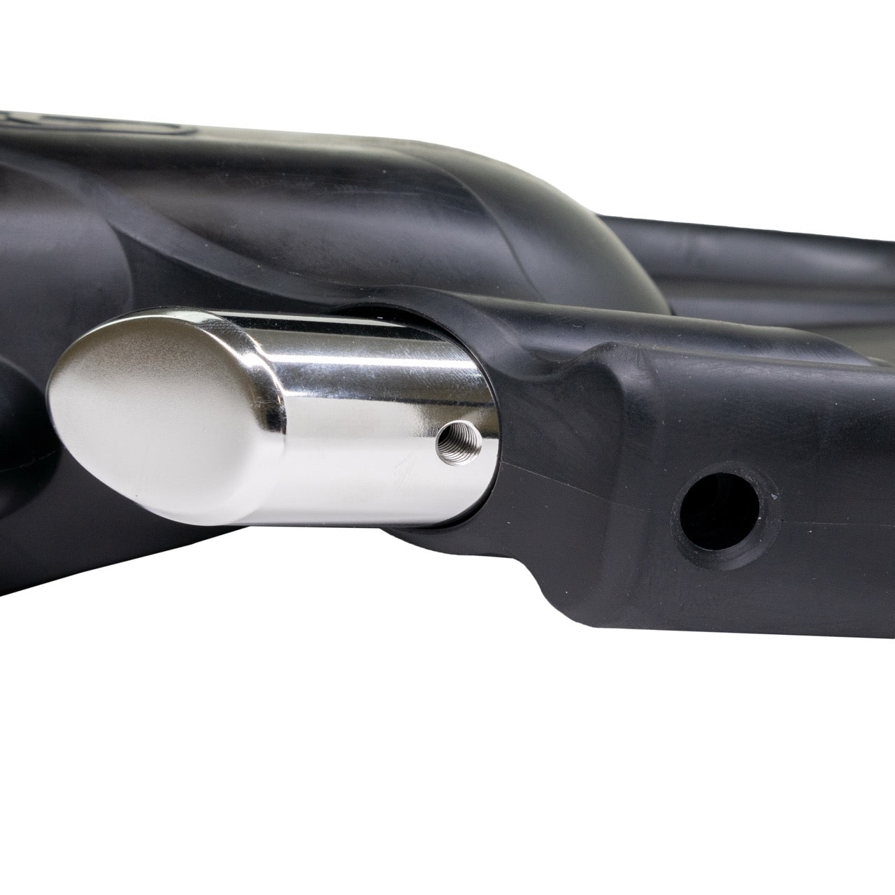 Close-up of a black Halcyon Vector Pro Fin with a silver add-on heavy weight, shown against a plain white background.