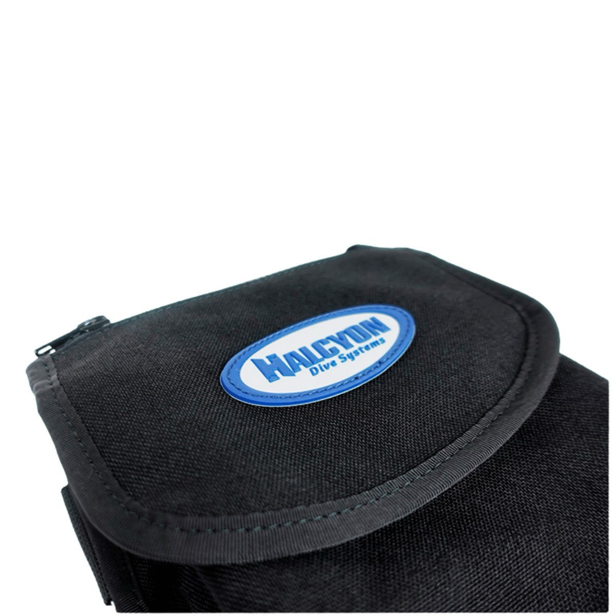 Close-up of black bellows pocket with white and blue Halcyon logo on white background