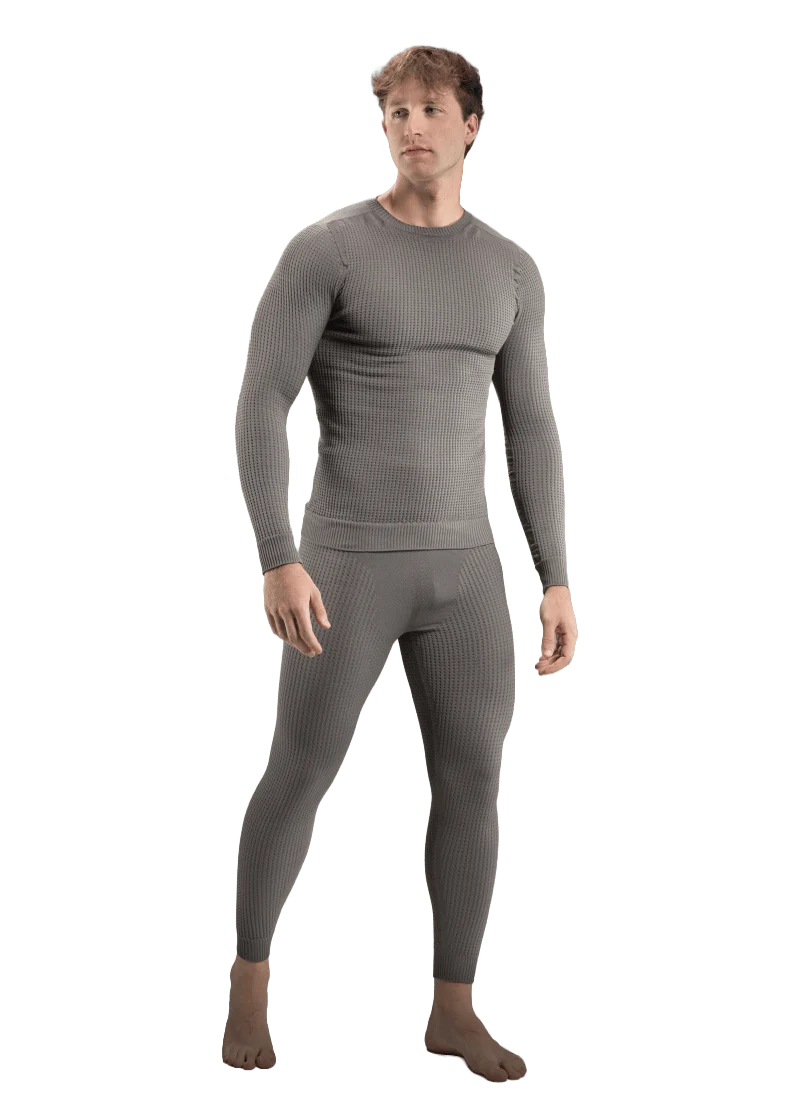 A man in grey KO1 drysuit base layer 