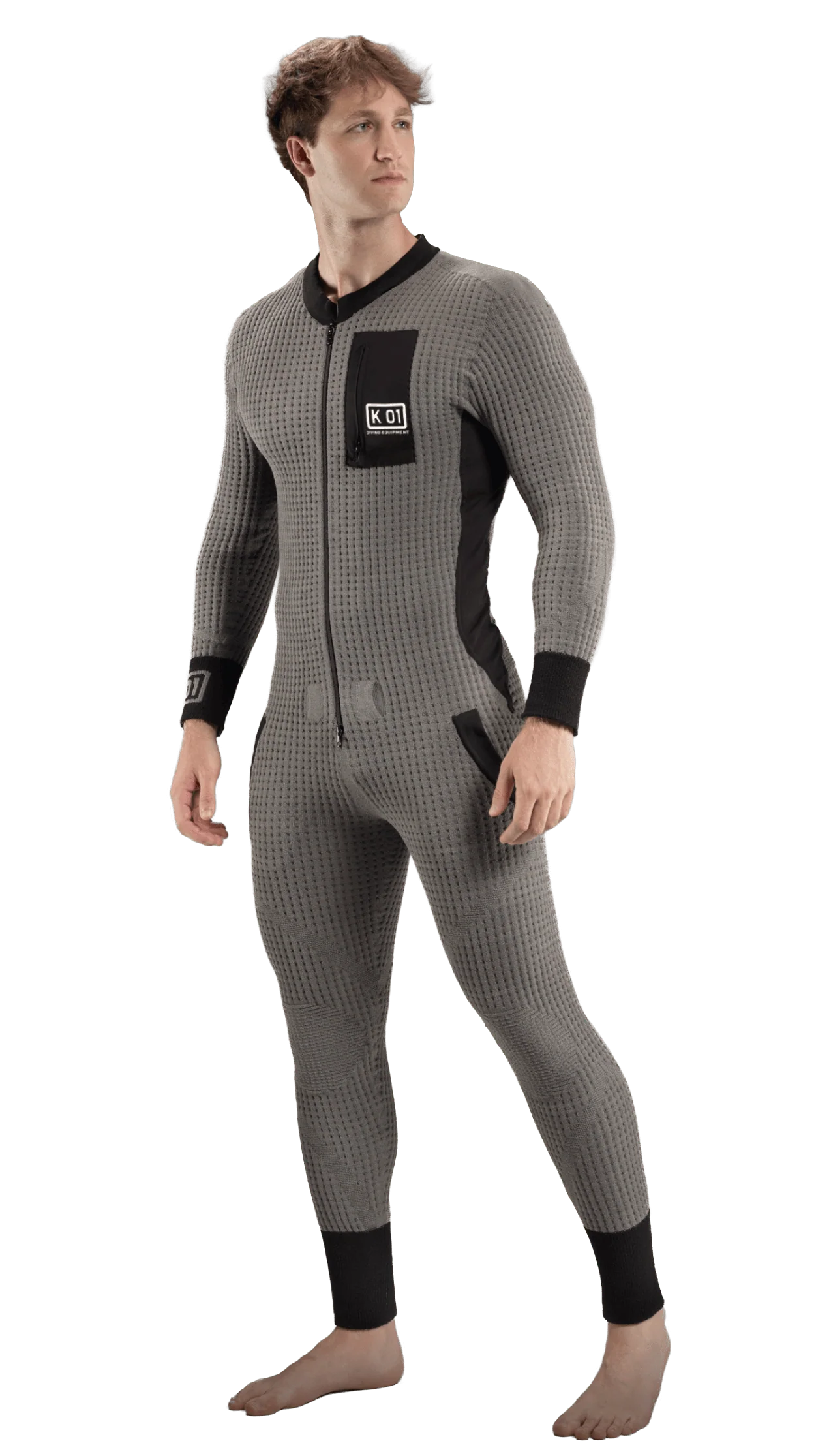 A man modeling a grey undersuit from KO1 for scuba divers