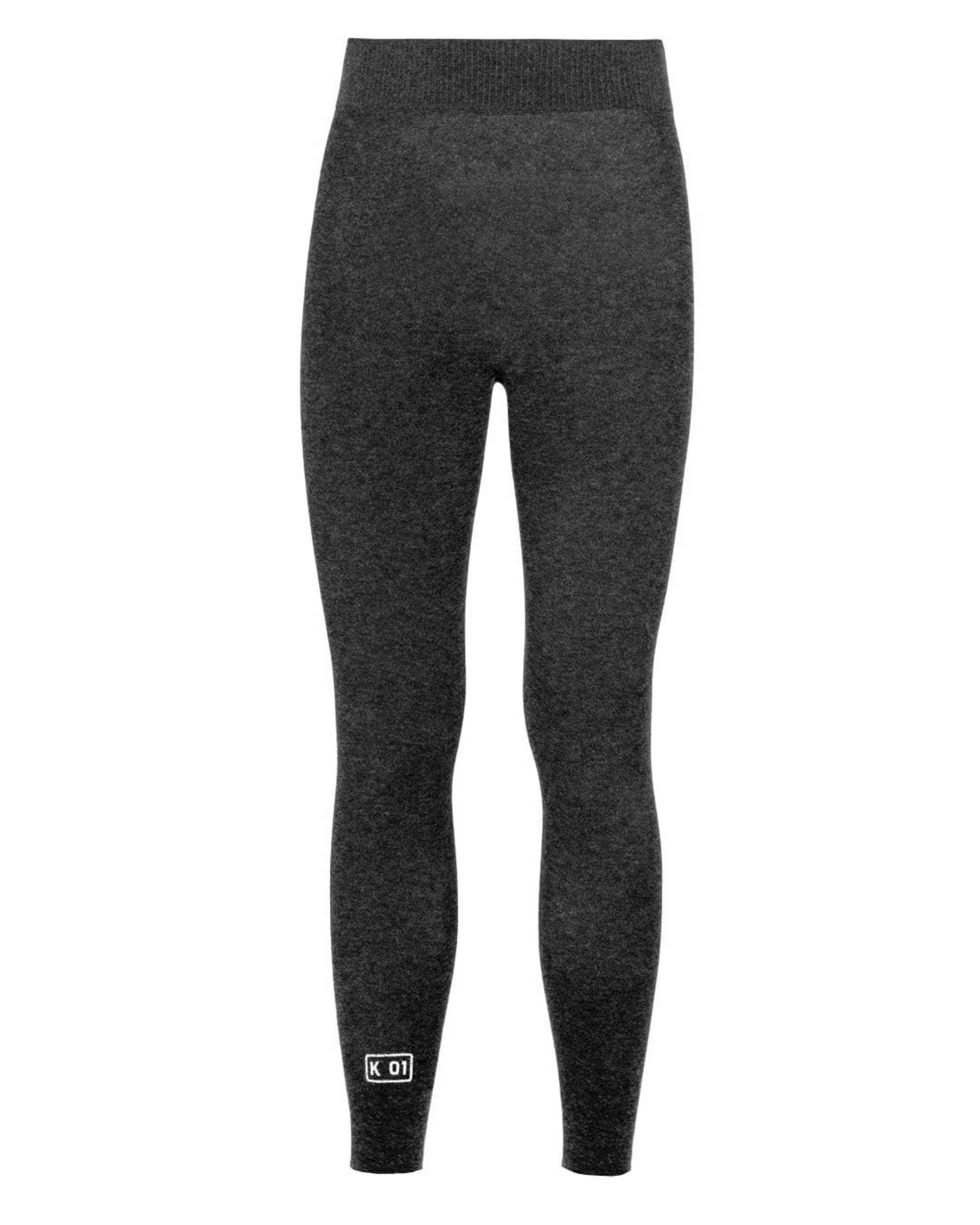 Grey pants with small white KO1 logo on white background