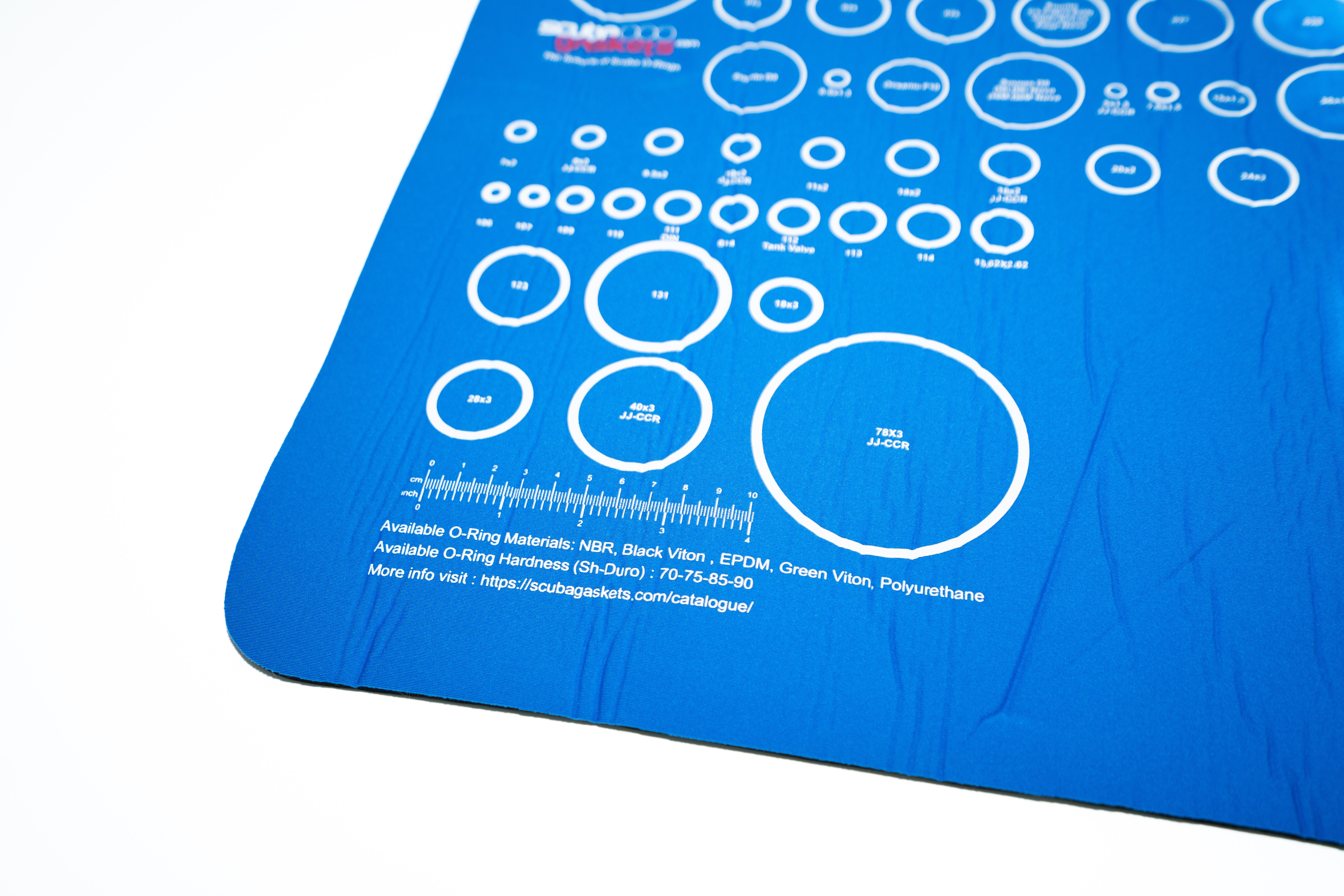 O-ring circles printed at actual size on the blue mat