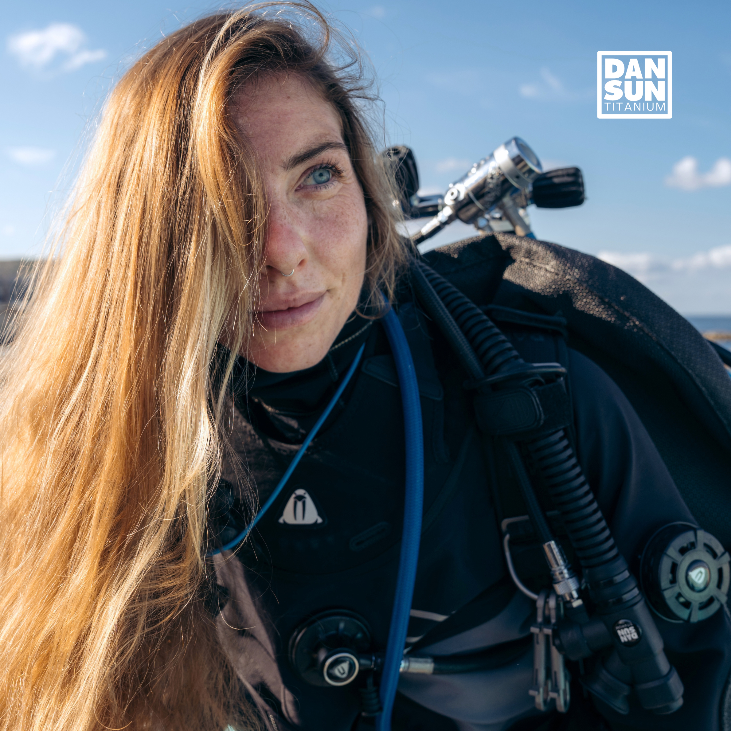 Diver wearing the DanSun MONO 32 BCD on a boat