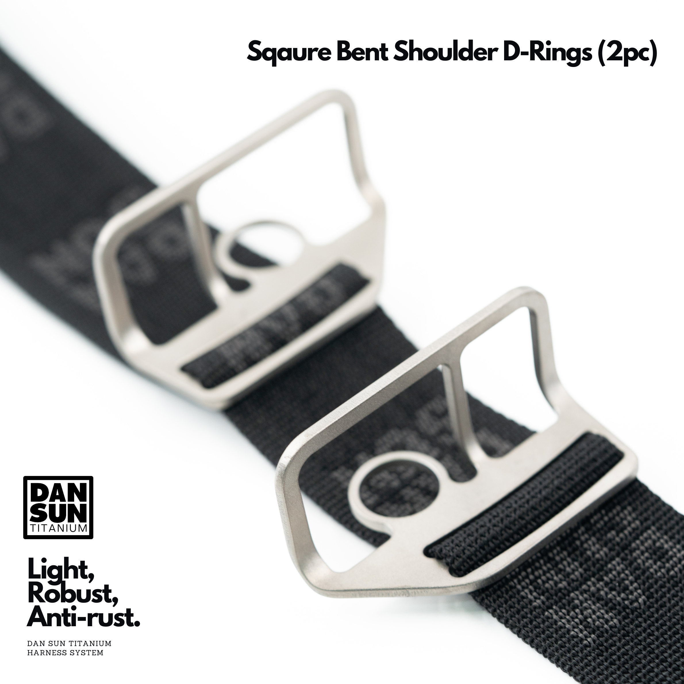 Square bent titanium shoulder D-rings on harness webbing