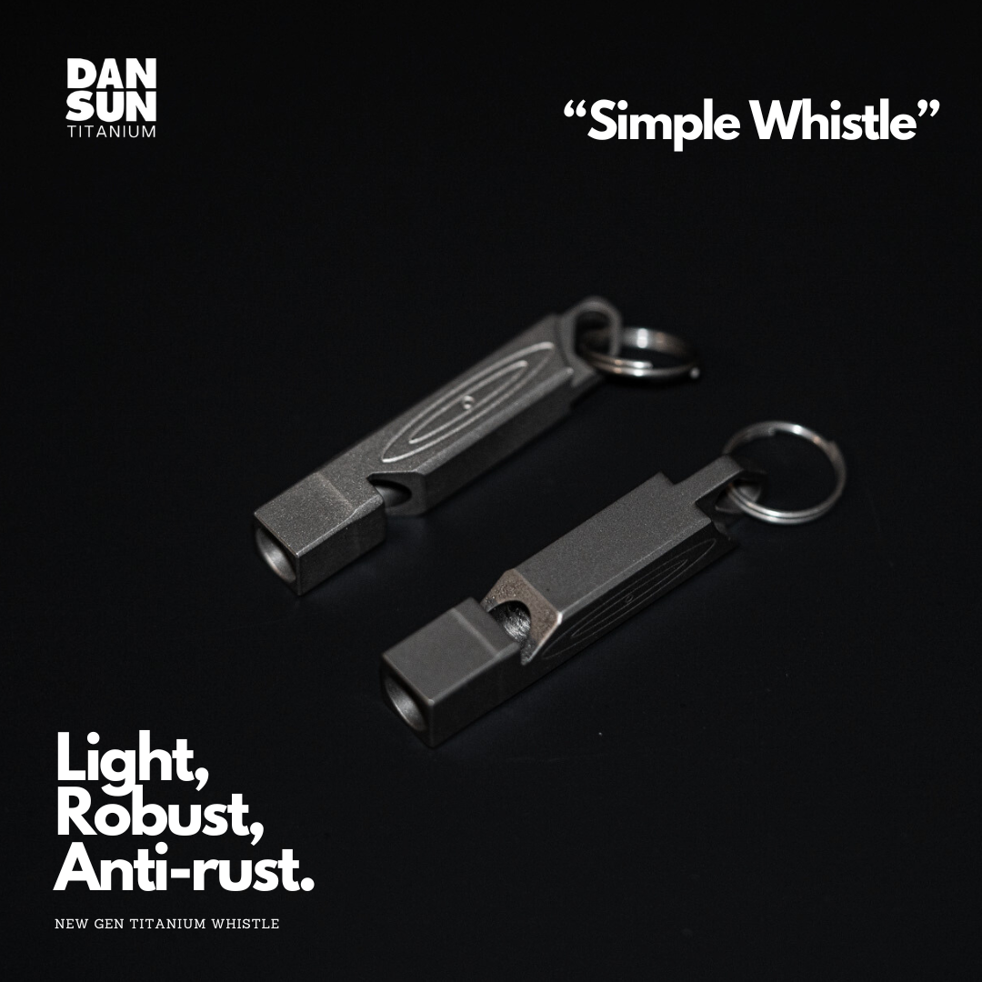 Two titanium whistles with key rings