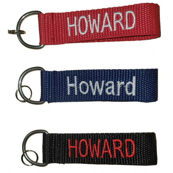 Embroidered cap markers in red, navy and black with the name Howard
