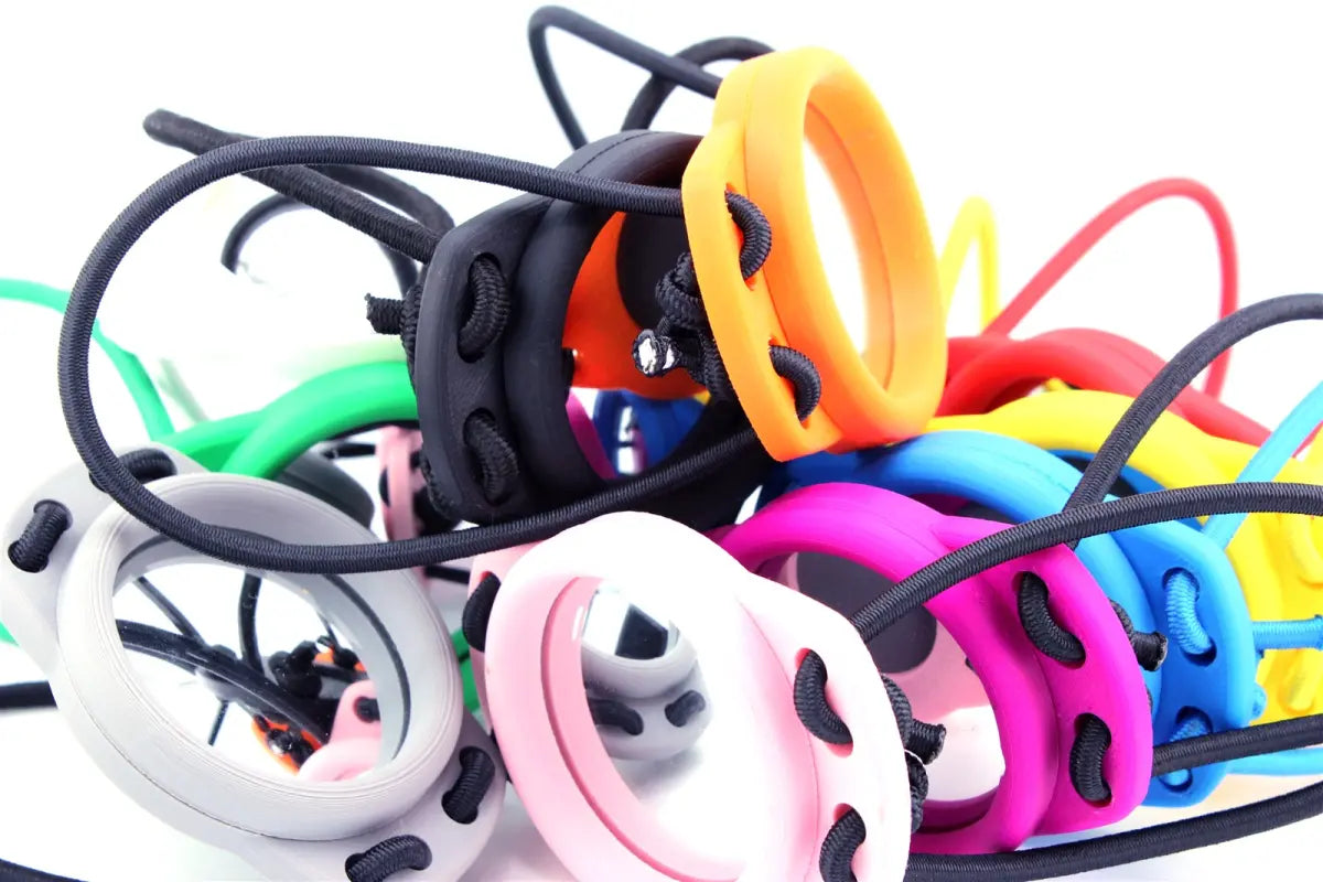 Pile of Dluxe dive mirrors and bungees in bright colours